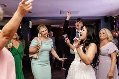 Bride dancing with guests, shared in the guestbook