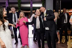 Groom singing with a guest
