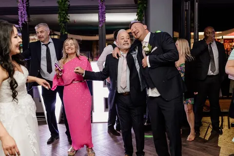 Groom singing with a guest